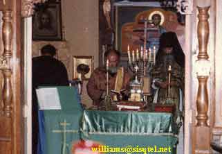 From L. to R - Fr. Herman, Fr. Deacon (now Priest) Vladimir Anderson, and Bl. Seraphim serving in the old church at the Saint Herman of Alaska Monastery - Copyright � The Blessed Seraphim Hermitage